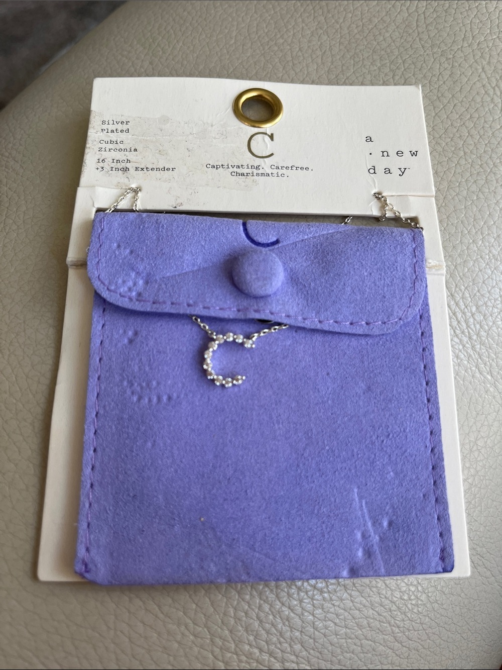 a new day Purple Pouch with Rhinestone 'C' Necklace!  New!